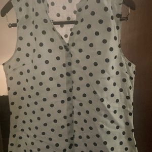 Women’s sleeveless button down top.